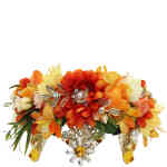 A floral crown that doubles as a tiara with oranges and yellow tones and crystals. Designed by Morgan and Taylor and available online and instore at ShoeBeDoo