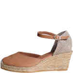A closed toe covered heel style espadrille covered in tan smooth leather, on a mid height wedge with a natural jute braided sole. Made in Spain by Toni Pons and available instore and online in Australia at ShoeBeDoo Official Stockist.