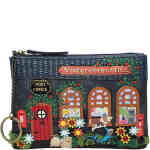 A zip up coin purse that holds notes and cards and a key in the shape of an old fashioned navy blue retro post office, with arched windows, a red wooden door, embroidered roses, and a dog postie on a bicycle! Vegan bag/accessory designed by Vendula London, available online and instore at ShoeBeDoo, official stockist in Australia