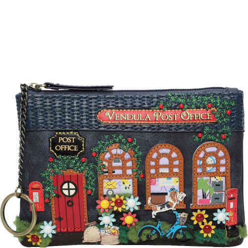 A zip up coin purse that holds notes and cards and a key in the shape of an old fashioned navy blue retro post office, with arched windows, a red wooden door, embroidered roses, and a dog postie on a bicycle! Vegan bag/accessory designed by Vendula London, available online and instore at ShoeBeDoo, official stockist in Australia