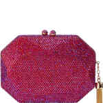 A multi-faceted gemoetric shared hard case clutch bag, that is adorned in a mermaid worthy iridescent array of red and hot pink crystals, that shine through in the light with magenta and violet. Designed by Olga Berg and available online and instore at ShoeBeDoo Official Olga Berg Stockist in Australia