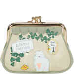 This is a framed coin purse with a kiss lock closure, and two separate compartments, and in soft sage green vegan leather, adorned with embroidered green vines, and 3D elements a creperie sign, and a gorgeous white fluffy dog. Vegan bag/accessory designed by Vendula London, available online and instore at ShoeBeDoo, official stockist in Australia