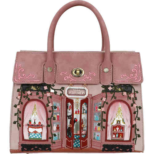 A fabulous well structured bag with lots of internal compartments and zips to keep you organised. . The front is a dusty blush coloured shop front off an ornate French perfumery with velvet curtains on the high vine embroidered windows, and in the centre are doors that open revealing cats and divine perfume bottles. Vegan bag/accessory designed by Vendula London, available online and instore at ShoeBeDoo, official stockist in Australia