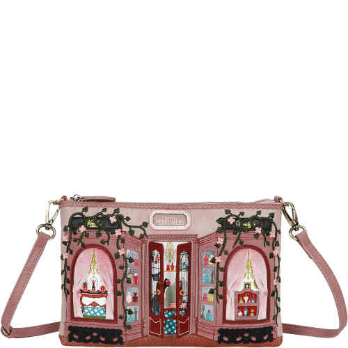 A medium sized rectangular pouch bag that is a crossbody bag to hold essentials but be slim against the body. The front is a dusty blush coloured shop front off an ornate French perfumery with velvet curtains on the high vine embroidered windows, and in the centre are doors that open revealing cats and divine perfume bottles. Vegan bag/accessory designed by Vendula London, available online and instore at ShoeBeDoo, official stockist in Australia