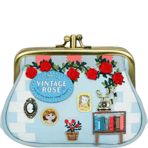 This is a framed coin purse with a kiss lock closure, and two separate compartments, and in soft pale blue soft vegan leather, adorned with embroidered roses, and 3D elements of a vintage phone, a book case with books, and artwork on the wall. Vegan bag/accessory designed by Vendula London, available online and instore at ShoeBeDoo, official stockist in Australia