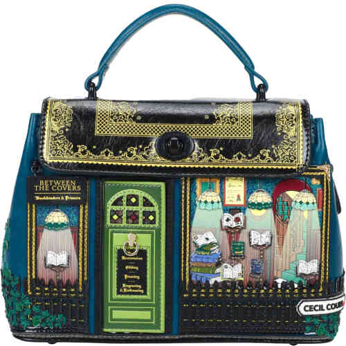 A compact mid size bag in the shape of a shop front with large windows featuring 3D books, a green door that opens, a fence, a street name, embroidered ivy, and a fold over "roof" which is a black book cover with gold fiilgree. ShoeBeDoo is an authorised stockist of Vendula london in Australia and New Zealand