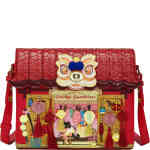 This structured postman style box bag is an absolute vision in rich red. The top is a roof which is thatched in style and opens up. The front is covered in loose attached lanterns with tassels, and a dragon head! ShoeBeDoo is an official stockist of vegan certified Vendula London Bags and Wallets in Australia and New Zealand.