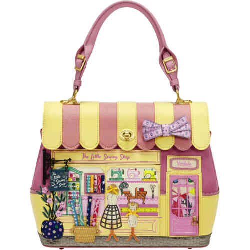 This shop front bag from Vendula depicts a stunning canopied top mid sized bag, with a pink tape measure as a bow on top. The front of the bag shows aThe Little Sewing Shop, cotton rolls of fabric, 3D appliqué of sewing machines and mannequins and even a crafty embroidered pot plant. ShoeBeDoo is an authorised stockist of Vendula London Certified Vegan Leather Bags and Accessories in Australia and New Zealand