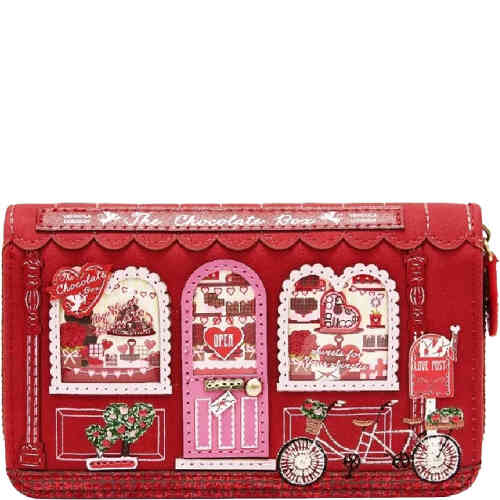 This is a medium wallet with two sections for cards and notes, and a separate zip around section for your coins and receipts. It features a red and pink shop front of a chocolate shop with glossy windows and a door showcasing sweet treats. ShoeBeDoo is an authorised stockist of Certified Vegan Vendula London bags and wallets in Australia and New Zealand.