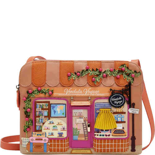 A large crossbody that features a travel shop in light and slightly darker terracotta colours. The windows feature 3D appliqué that shows travel maps, luggage, sunglasses, travel books, and even a door that opens! ShoeBeDoo is an official stockist of Vendula London bags and wallets in Australia and New zealand